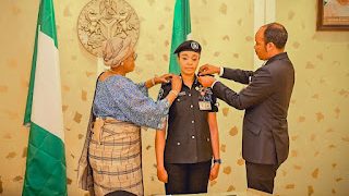Nigerian First Lady Decorates Newly Promoted Officer From Her Office